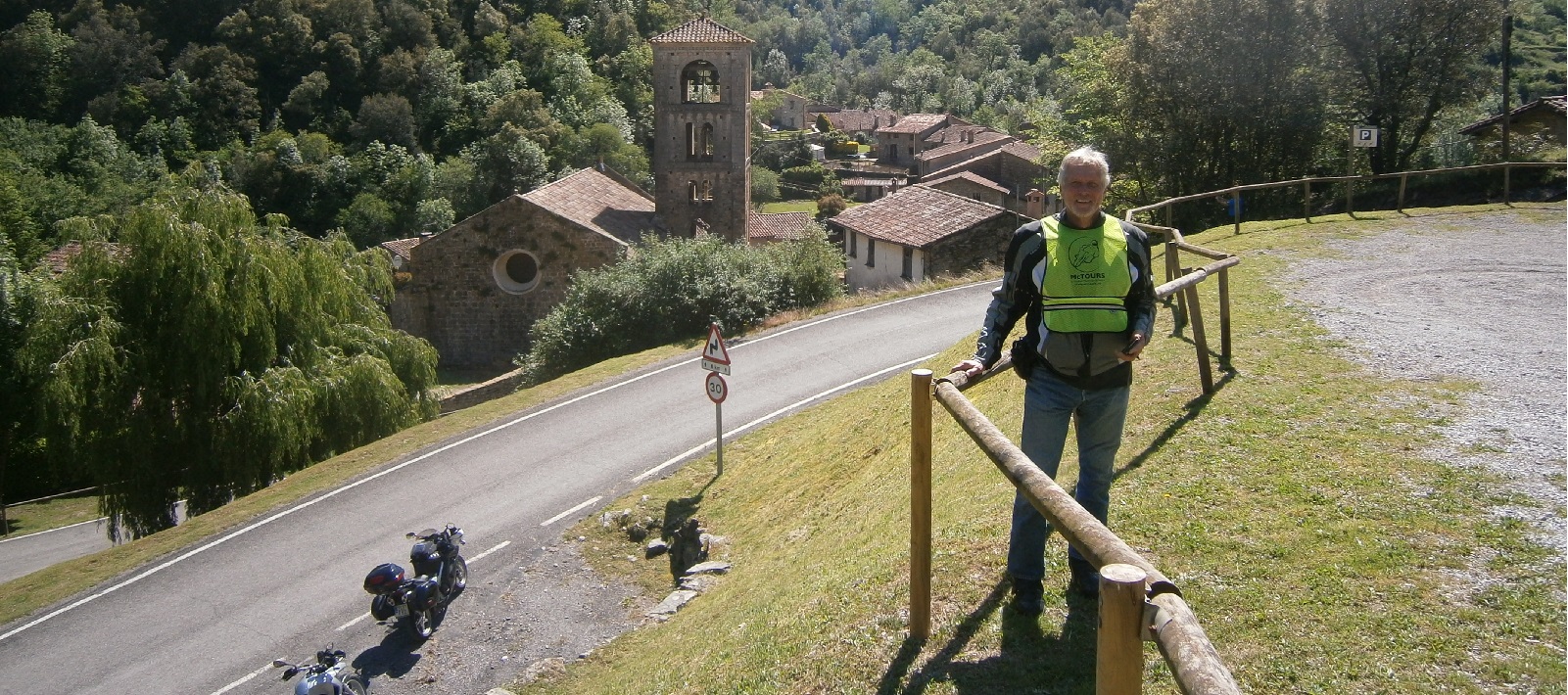 Rider stopped to pose at hairpin bend 
